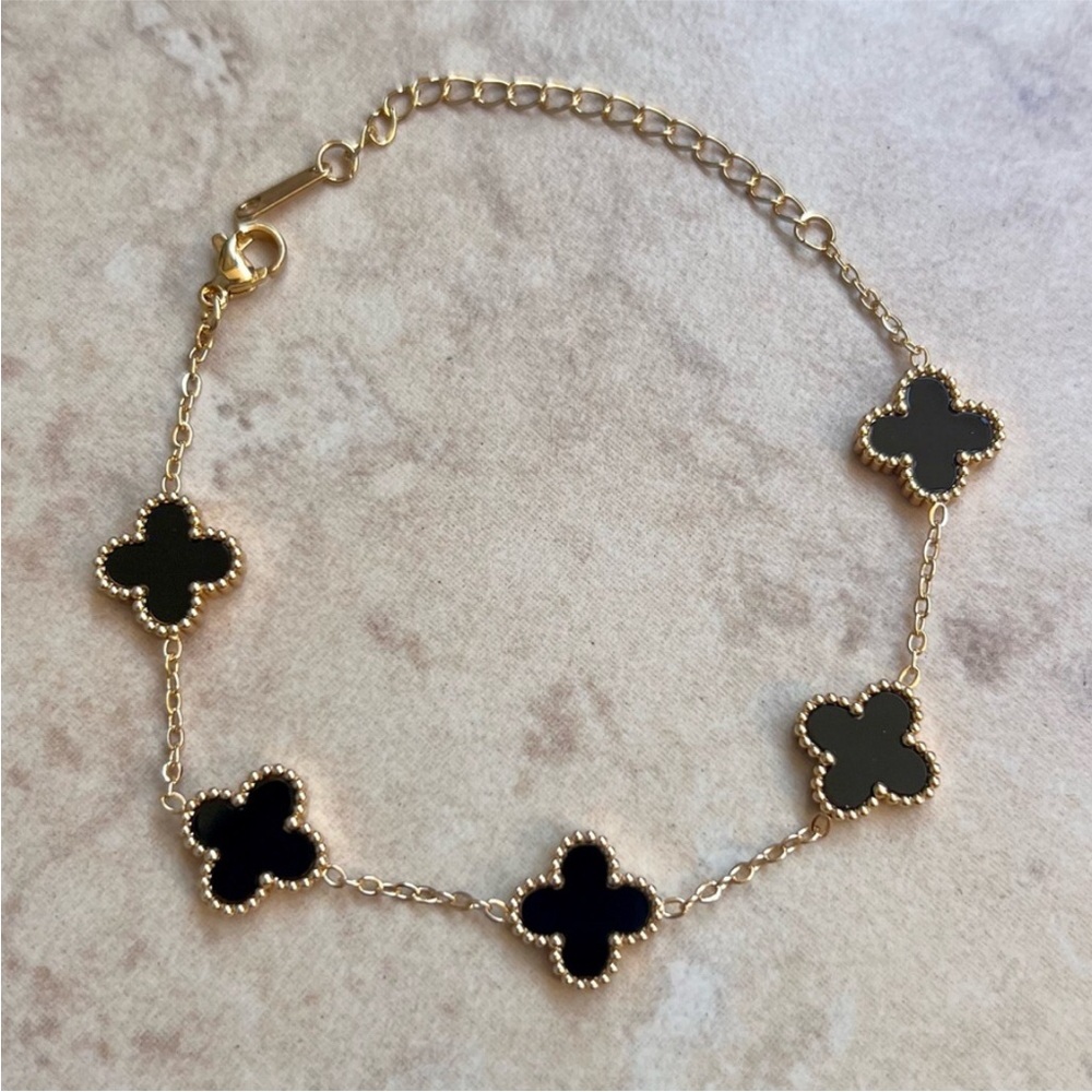 Stainless Steel Gold Four-Leaf Clover Link Bracelet with Black Accents